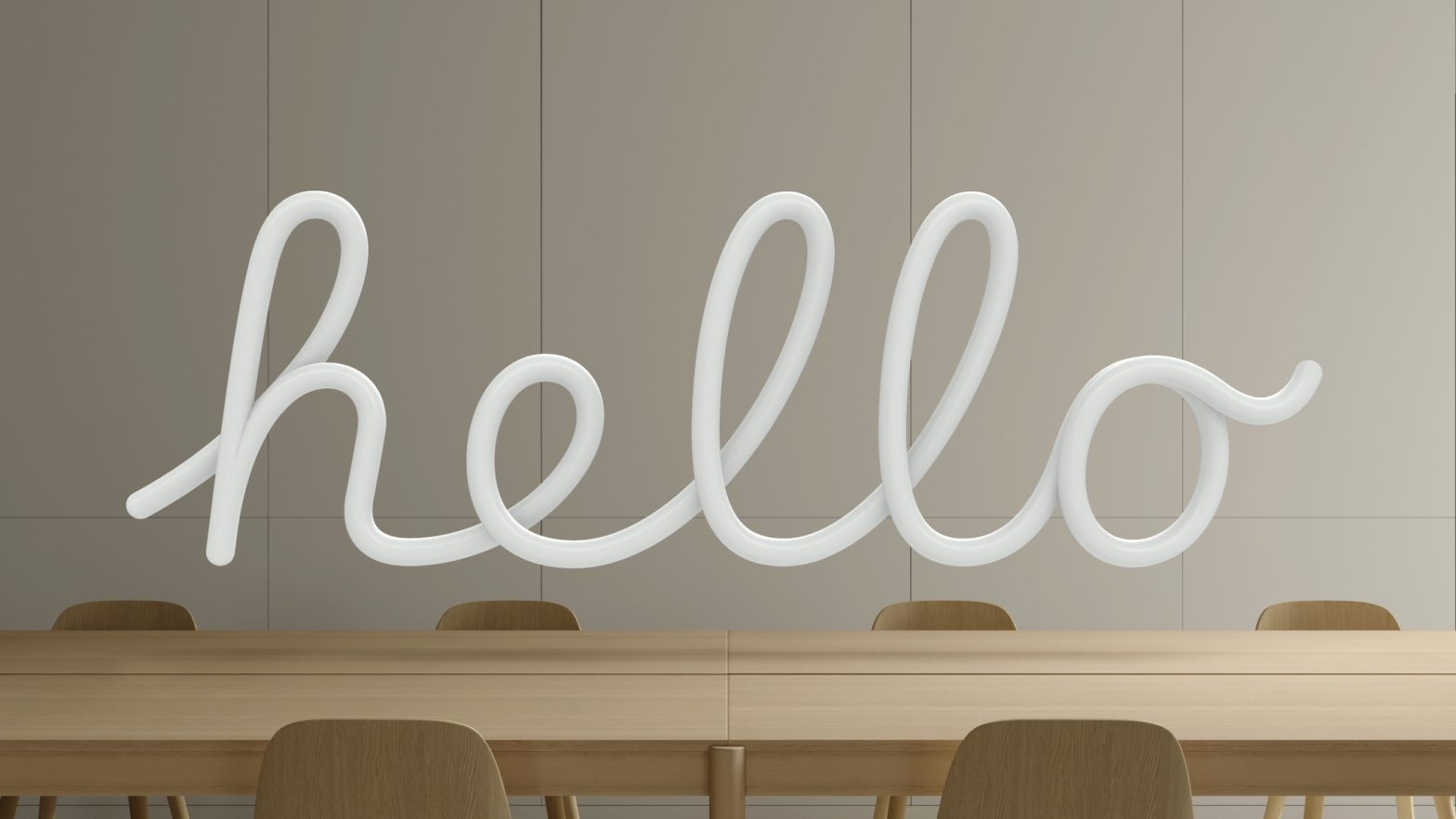 An image with the word “Hello” written in script and floating in 3D space over a light wooden table.